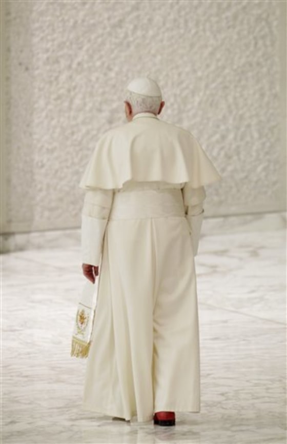 Pope Benedict XVI leaves at the end of an audience with newly-appointed cardinals and their relatives, in Paul VI Hall, at the Vatican on Monday.